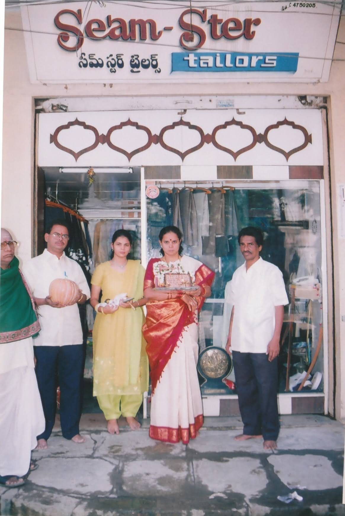 2004 - Family photo under the store signage